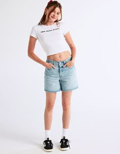 Levi's 501 Mid Thigh Shorts. The First-Ever Jean Shorts. Modeled After The 501® Original Jeans, These Denim Shorts Were Made With Our Iconic Vintage-Inspired Fit, A Flattering High Rise And A Longer Inseam. To This Day They They've Never Gone Out Of Style. And They Never Will. Straight Through Your Hip And Thigh. Rise: 10.5". Inseam: 6". Measurements Based On A Size 30 Waist. Heavyweight Denim. Stretch. Button Fly. 5-Pocket Styling. 99% Cotton, 1% Elastane. Machine Wash. Imported. Model Is Wearing A Size 26. Model Measurements:height: 5'7" Bust: 32"waist: 23"hips: 32" | Levi's 501 Mid Thigh Shorts - Take Off Long Jean Shorts Outfit, Mom Shorts Outfit, Levi Jorts, Long Jean Shorts, Jean Short Outfits, Wwe T Shirts, Mid Thigh Shorts, Jeans Low Rise, Girls Blouse