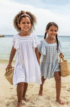 This playful cover-up will be your little one's favorite beach accessory thanks to swingy tassels tracing the layered flutter sleeves and ladder-stitched hem. Slips on over head UPF 50+ sun protection 100% viscose Hand wash, line dry Imported Playful Ruffle Sleeve Beach Dress, Playful Ruffled Dresses For Vacation, Summer Vacation Dress With Ruffle Sleeves, Summer Vacation Dresses With Ruffle Sleeves, Casual Flutter Sleeve Beach Dress, Bohemian Ruffle Sleeve Dress For Vacation, Casual Beach Dress With Flutter Sleeves, Bohemian Dress With Ruffle Sleeves For Vacation, Playful Beach Dress With Ruffle Hem