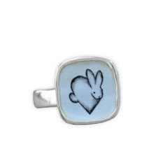 This adorable Rabbit ring will bring you joy every time you wear it. I carved the sterling silver ring setting from a block of wax, then cast that wax ring into metal and molded it so I can make multiples. This ring setting then gets a layer of vitreous enamel (fine glass) and fired at 1400 in a kiln four separate times to build strength and color saturation . Finally I take an illustration from my sketchbook, turn it into an enamel  screen print, and fire that on the top for a durable, waterpro Bunny Ring, Rabbit Ring, Bunny Jewelry, Rabbit Jewelry, Enamel Art, Wax Ring, Vitreous Enamel, Sterling Silver Rings Set, Silver Ring Set