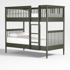 a green bunk bed with white sheets on it