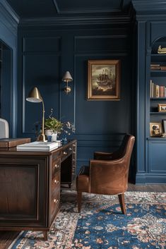 an office with blue walls and furniture in the corner, along with a rug on the floor