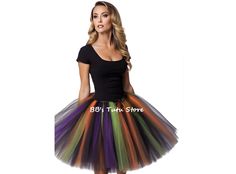 Get ready to cast a spell and embrace your inner witch with our custom-made Fluffy Witch Tutu Skirt. This enchanting skirt is perfect for creating your own unique costume and making a statement at Halloween parties, cosplay events, or any other occasion that calls for a touch of magic. Crafted with care, this tutu skirt is made by tying strips of tulle to a comfortable elastic band. The result is a voluminous and fluffy skirt that adds a whimsical and playful element to your outfit. The tulle strips are available in bewitching colors such as Black, Orange, Purple, and Green Apple, allowing you to create a spellbinding combination that suits your style. To complete the witchy look, this tutu skirt comes with a decorative satin black bow. The bow adds a touch of elegance and serves as a capt Fantasy Skirt For Halloween Costume Party, Witchy Fitted Skirt For Cosplay, Fantasy Costume Black Skirt, Fantasy Black Skirt For Costume, Witchy Fitted Skirt For Costume Party, Witchy Skirt For Costume Party, Black Skirt For Halloween Costume Party, Halloween Fitted Tulle Skirt, Gothic Skirt For Halloween Costume Party