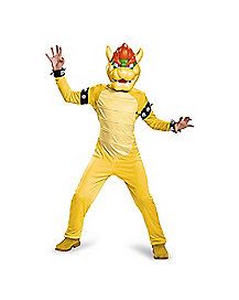 a man in a yellow costume is standing with his arms outstretched and hands out to the side