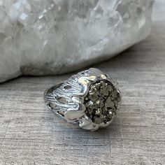 Sterling silver pyrite ring, Flower ring, raw stone ring, Druzy crystal ring, gifts for women, made in Armenia All our jewelry is made of high-quality sterling silver and is stamped with a 925 stamp 【FULL DETAILS】 ► Gemstone: natural pyrite ► RING SIZE: all size available ► RING WEIGHT: approx. 15 gr (0.033 lb0 ⦿ Attention: The color of the stones may differ due to a difference between monitors ◦* ◦* ◦* ◦* ◦* ◦* ◦* ◦* ◦* ◦* ◦* ◦* ✔️ Please, view my store policies before buying this item here. ht Silver Crystal Ring With Large Stone As Gift, Silver Nugget Jewelry For Anniversary, Sterling Silver Crystal Ring With Natural Stones, Silver Crystal Open Ring With Stone Setting, Silver Open Ring With Stone Setting, Spiritual Silver Crystal Ring Gift, Spiritual Silver Crystal Ring For Anniversary, Silver Crystal Ring For Anniversary, Unique Silver Gemstone Geodes