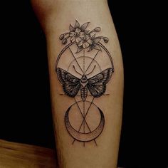 a tattoo on the leg of a person with a butterfly sitting on top of it