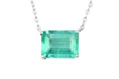 Featured here is a 1.50-carat stunning, Colombian emerald necklace in fine sterling silver. Displayed in the center is a medium-light green emerald with very good eye clarity, accented by a simple four-prong silver mount, allowing for the emerald to be shown in full view. The earth mined, green Colombian emerald has a desirable lush green color with excellent qualities. An 18 inch is attached to the emerald pendant. This necklace is ideal for everyday use and is the perfect accessory to any outf Formal Hallmarked Emerald Necklace, Hallmarked Emerald Necklace, Dazzling Formal Emerald Gemstone Necklace, Classic Emerald Cut Sterling Silver Gemstones, White Gold Emerald Necklace In Sterling Silver As Gift, Elegant Emerald Pendant Gemstones, Elegant Sterling Silver Gemstones With Prong Setting, Elegant Silver Emerald Necklace Gift, Classic White Gold Emerald Necklace