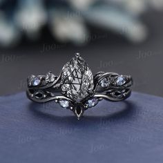 a close up view of a ring with diamonds on it's sides and an intricate design