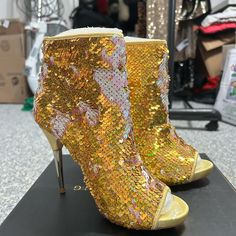 New Without Box. Gold Sequin Peep-Toe Ankle Boots With Stiletto Heel And Zipper Closure. Size Eu 37 Us 6.5. Please See Photos For More Details. Round Toe Booties For Fall Parties, Fall Party Booties With Round Toe, Party Heeled Boots With Reinforced Heel And Round Toe, Party Heeled Boots With Reinforced Heel, Round Toe Heeled Boots With Reinforced Heel For Party, Gold Heeled Boots With Reinforced Heel And Round Toe, Spring Party Boots With Round Toe, Gold Closed Toe Boots For Party, Gold Boots With Round Toe And Medium Width