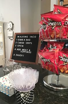 there is a sign that says donuts and chips on the counter in front of it