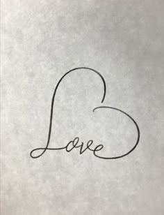 the word love is written in cursive writing