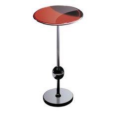 a red and black table sitting on top of a metal stand