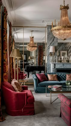 a living room filled with furniture and a chandelier