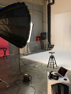 a photo studio with lights and equipment in it