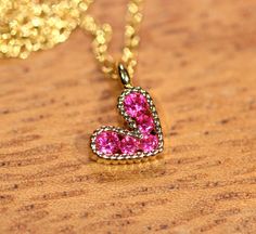 Tiny heart necklace - pink heart necklace - gold heart necklace - love necklace - bff necklace An itty bitty magenta pink heart having happily from a 14k gold vermeil chain at the length of your choice! This tiny, gold plated brass heart holds 5 sparkly crystals. Heart measurement: 8mm Looking for other charm necklaces? https://www.etsy.com/shop/BubuRuby?section_id=12318467 More from Bubu Ruby? https://www.etsy.com/shop/BubuRuby?ref=si_shop ♥ Handmade with love in sunny California ♥ These gems w Pink Heart Pendant Necklace With Clavicle Chain, Pink Heart Necklace On Clavicle Chain, Pink Heart Pendant Charm Necklace, Pink Heart Pendant Charm Necklace With Clavicle Chain, Pink Heart Pendant Clavicle Necklace, Pink Heart Charm Necklace With Adjustable Chain, Pink Heart-shaped Jewelry With Clavicle Chain, Pink Heart Pendant Necklace With Adjustable Chain, Pink Heart Pendant Charm Necklace On Clavicle-length Chain