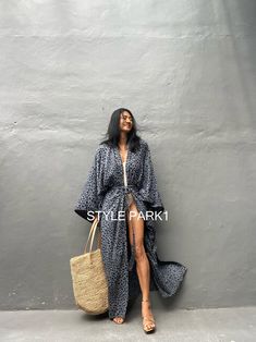 Leopard Kimono long jacket, It's made by the Bali's traditional hand Print If you are very small this may be too big. Stylepark1 Model -Her height is 175Cm/5.74ft weight is 64kg/141.09Ib /American size, she wore ~ M to large size. Made from soft Rayon At first, you may smell of the unique dye. It will disappear after you wash it. So do not worry. color - Bali Hand print gray base & black motif Model wore / A A - Length - 150cm /59inch Width - Chest & hip 75cm/150cm (59inch) round I recommend Ame Oversized Long Beach Robe, Oversized Long Sleeve Robe For Beach Cover-up, Oversized Black Outerwear For The Beach, Long Black Kimono For Beach Cover-up, Traditional Open Front Kimono For Vacation, Long Sleeve Robe For Fall Vacation, Fall Vacation Long Sleeve Robe, Long Black Beachwear Kimono, Black Long Beachwear Kimono