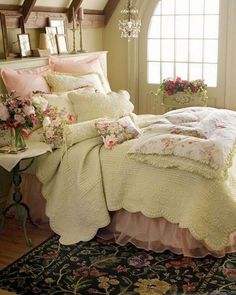 a bed in a bedroom next to a window and rug with flowers on the floor