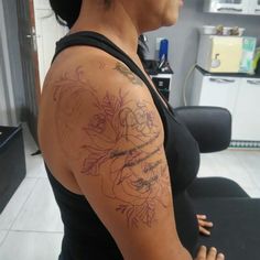 a woman with a tattoo on her arm