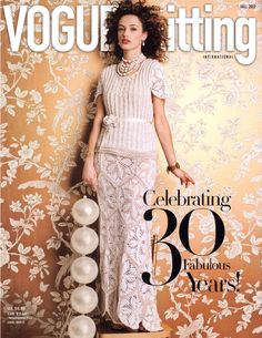 a magazine cover with a woman in white dress and pearls on her head, holding a handbag