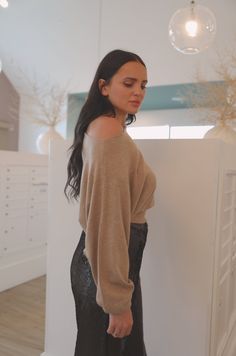 Experience luxury with this soft camel beige boat neck sweater top. It can be worn off the shoulder or pulled up to keep you comfortable while still looking sophisticated. The long sleeves give a flattering silhouette, perfect for any occasion. Pair the boatneck top with our Black Sequin Pants for an elegant dinner look. boatneck can be worn off the shoulder long sleeve model is wearing a small Beige Off-shoulder Winter Tops, Chic Oversized Boat Neck Top, Beige Off-shoulder Tops For Fall, Chic Oversized Off-shoulder Sweater, Chic Batwing Sleeve Sweater For Loungewear, Versatile Long Sleeve Off-shoulder Top For Fall, Casual Off-shoulder Top For Fall Night Out, Chic Off-shoulder Long Sleeve Top For Winter, Chic Beige Soft Knit Cropped Sweater