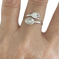 About item Item:- Fork and Spoon ring Material:- 925 sterling silver Title:- Vintage Sterling Silver Fork and Spoon Adjustable Ring, Fork Ring, Spoon ring, Gift For mom, Kitchen set ring, Gift For her, Women's ring Description:- We use 925 sterling silver to making jewelry. We accept all types of custom & personalized order. Please send us a message if you are interested in a custom creation. Shipping profile:- We ship all order within 3-5 days. But custom order takes time. Customer service :- If you have any question about our products & services, feel free to contact us. We do always best for our customers Other Specification:- Please Visit Our Shop home page to view our complete collection. If you need express shipping, please choose express shipping profile during checkout. Please make Sterling Silver Open Band Jewelry Gift, Sterling Silver Open Band Jewelry For Gifts, Sterling Silver Ring For Mother's Day, Nickel-free Rings For Anniversary And Mother's Day, Adjustable Nickel-free Rings For Mother's Day, Silver Ring Jewelry For Mother's Day, Silver Rings For Mother's Day, White Gold Open Ring Jewelry For Mother's Day, Mother's Day White Gold Open Ring Jewelry