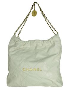 Chanel White Leather Chanel 22 Tote Bag. Features gold hardware spelling out CHANEL Made In: Italy Color: White Hardware: Goldtone Materials: Leather, metal Lining: Beige textile Closure/Opening: Open top Exterior Pockets: None Interior Pockets: Removable zip top pouch Exterior Condition: Excellent pre-owned condition with the exception of light wear to corners and small spot at back- see photo Interior Condition: Excellent pre-owned condition Includes: Chanel dustbag Measurements: 13.5"L x 13.5 Chanel Gold Bag, Chanel 22, Chanel Tote Bag, White Hardware, Chanel White, Gold Bag, Open Top, White Bag, Zip Top