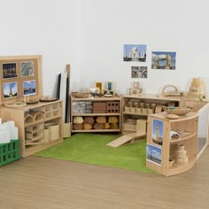 a play room with wooden furniture and pictures on the wall