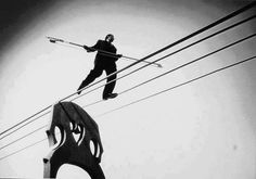 a man riding skis on top of a metal structure