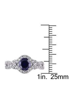 Express your devotion with this marvelous Created Blue and White Sapphire Halo Engagement Ring. Crafted in lustrous sterling silver, this ring features a round-cut (6.5mm) created blue sapphire gemstone at the center and round-cut (1.5mm) created white sapphire gemstones along the sides. This ring is enhanced with a high polish finish. | Belk & Co Lab Created 2 1/10 CT TGW Created Blue and Created White Sapphire Crossover Twist Ring in Sterling Silver, 6 Anniversary Sapphire Jewelry With Vs Clarity, Sapphire Diamond Cut Promise Ring Jewelry, Sapphire Jewelry With Vs Clarity For Anniversary, Dazzling Sapphire Jewelry With Center Stone, Fine Jewelry Sapphire With Round Cut, Fine Jewelry With Sapphire In Round Cut, Fine Jewelry In Sapphire With Round Cut, Sapphire Cubic Zirconia Jewelry With Center Stone, Sapphire Jewelry With Diamond Accents Round Cut