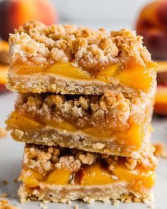 three pieces of peach crumb bars stacked on top of each other