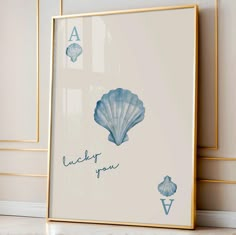 there is a framed photo with the words lucky you and an image of a sea shell