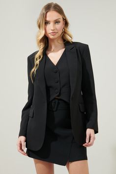 Big boss energy. Strut your stuff in this fitted blazer. Features a flattering notch lapel and a single breasted button to secure the jacket closed. It's the perfect layering jacket and can be paired with the matching vest and pants to complete a three piece suit.- Fitted - Notch lapel- Single breasted- Functional pockets- Comes in 7 colorsSize + Fit - Model is 5'9" and wearing size XS- Measurements taken from size S - Chest: 17 1/4"- Length: 29 3/4" Fabric Self:96% Polyester 4% Spandex Lining: Sleek Single Breasted Notched Blazer, Formal Notched Black Blazer, Black Notch Lapel Suit For Career, Single Button Notched Blazer For Career, Career Blazer With Single Button And Notched Shape, Career Blazer With Single Button And Suit Collar, Career Notched Blazer With Single Button, Tailored Black Blazer Dress For Career, Sleek Notched Blazer For Career