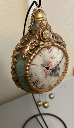 an ornate clock hanging from a wall