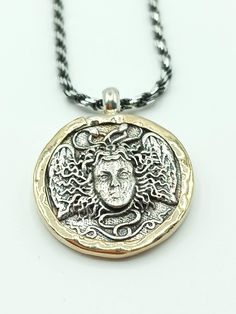 Absolutely Gorgeous hand crafted two tone Gold & Silver Medusa pendant. Medusa Replica is made of 925 Sterling silver. Frame is masterfully hand made from polished 9KT Gold. Italian chain is 18 inches long plus extension for A perfect fit. Medusa Medallion, Medusa Pendant, Widows Mite, Italian Chain, Sacred Symbols, Sterling Silver Charm Bracelet, Silver Charm Bracelet, Silver Frame, Sterling Silver Charm