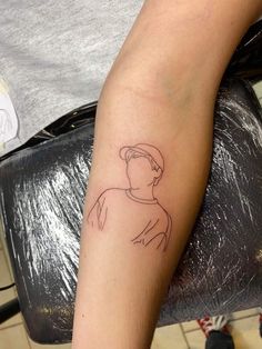 a person with a small tattoo on their arm