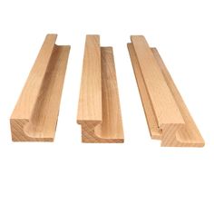 three pieces of wood sitting next to each other