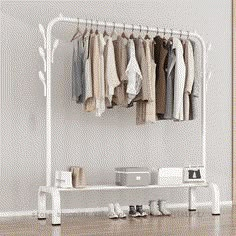 a white rack with clothes and shoes on it