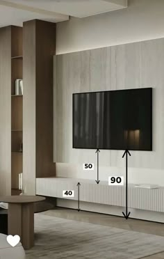 a living room with a large flat screen tv on the wall