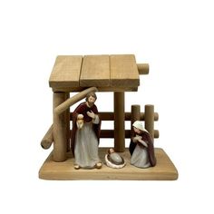 a nativity scene with three people and a baby jesus