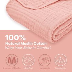 a pink blanket with the words 100 % natural muslin cotton wrap your baby in comfort