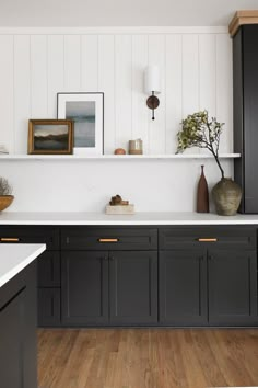 the kitchen is clean and ready for us to use it's dark gray cabinets