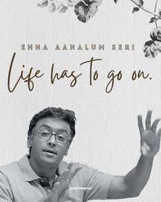 a man with glasses is holding up his hand in front of the words life has to go on