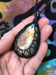 Made with durable linhasita cord, which is a waxed, polyester cord from Brazil! Features a beautiful, polished Multicolored Labradorite cabochon that measures about 2 1/2 inches long. Necklace cords are approximately 20 inches long. I recommend keeping your jewelry out of water and other corrosive elements to help it last longer! Have a question? Message me! Crochet Crystal Necklace, Macrame Stone Wrapping Tutorial, Crystal Necklace Diy, Macrame Crystal Necklace, Crystal Holder, Hemp Jewelry, Fiber Jewelry, Micro Macramé, Stone Wrapping