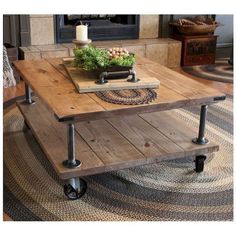 a coffee table with wheels on it in front of a fire place and rugs