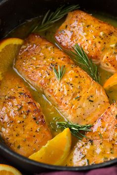 salmon with lemons and rosemary in a pot