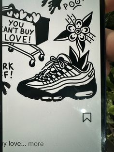 a person holding up a phone case with an image of a shoe on it and the words you can't buy love