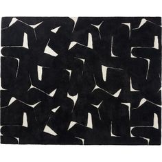 a black and white rug with an abstract design