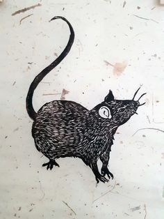 a drawing of a rat is shown on the side of a white paper with black ink