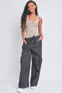 Every day is a new chance to wear our Women’s Relaxed Fit Cargo Pants. This high-waisted nylon pant features a relaxed fit for both style and comfort, ensuring you’ll look good and feel good throughout the day. Includes classic front pockets, three cargo pockets with button closures, and faux back pockets for maintaining a smoothing effect on your bum. These trendy pants are detailed with metal d-rings on the front belt loops and a drawstring waist so you can adjust the fit to your liking. Style