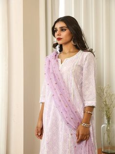 Beautiful handcrafted straight kurta pants set with lace details in pure cotton with lovely matching cotton doriya dupatta that is rightly finished with mirror embroidery. Color: Lavender Fabric: Cotton and Kota Doria Note: Length and sizes can be customised Length - Kurta 40 inches Pants 38 inches Available in other colors If you happen to see some deformity in hand-work or fabric, that’s mere the technique of the same and not a defect. The garment is quite premium. The product will be delivere Gulabo Jaipur, Mirror Work Dupatta, Kurti Styles, Cotton Kurta Set, Kurta Pants, Lavender Fabric, Lavender Cotton, Mirror Embroidery, Kurta Set For Women