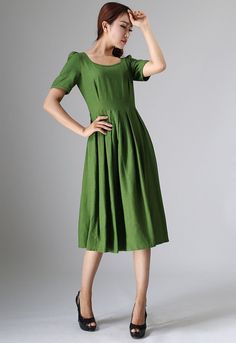 "This Prairie Linen dress is designed with soft linen in forest green hues, perfect with Puff sleeve, round neckline, and back button closure, This womens swing dresses can be styled with light weight a accessories for a daring ensemble . vintage inspired design, Handmade by Xiaolizi. DETAILS 50% linen, 50% Cotton, Medium weight Linen No lining Square neckline Short Puff Sleeve Seam pockets Back Zipper Below Knee length Spring, Summer House dress More color and More size https://etsy.me/2TGUAgq Green Puff Sleeve Dress With Gathered Sleeves, Green Midi Dress With Pleated Sleeves, Green Knee-length Midi Dress With Gathered Sleeves, Casual Dark Green Short Sleeve Dress, Dark Green Short Sleeve Midi Dress For Spring, Dark Green Short Sleeve Dresses For Spring, Green Midi-length Puff Sleeve Dress With Gathered Sleeves, Green Midi Length Puff Sleeve Dress With Gathered Sleeves, Green Midi Puff Sleeve Dress With Gathered Sleeves